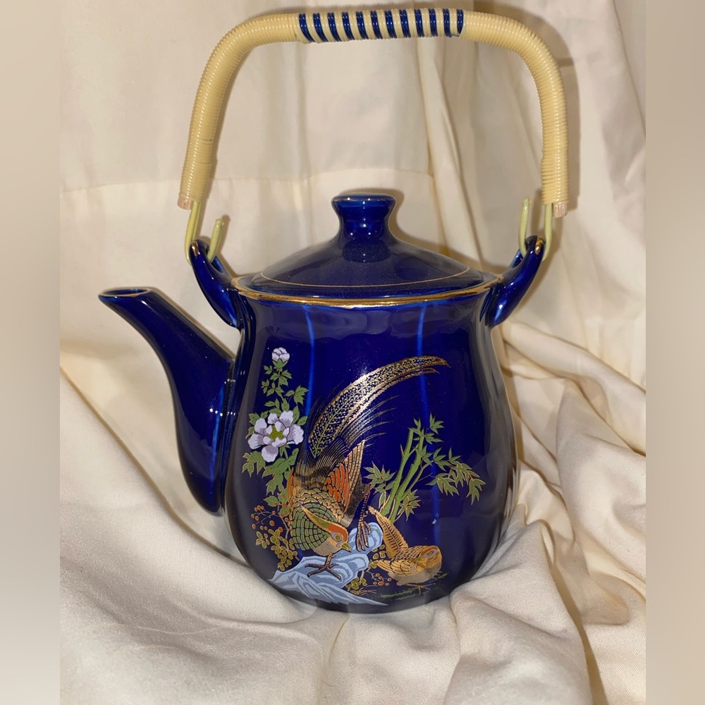 A vintage blue tea pot